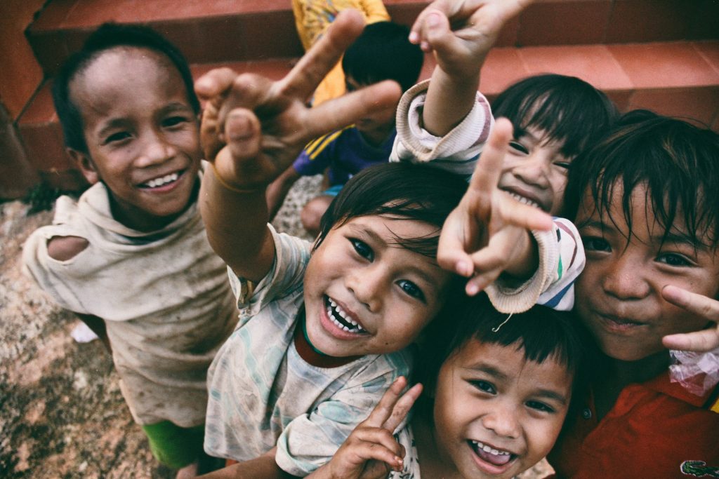 Children gathered at a community learning center supported by POM Foundation